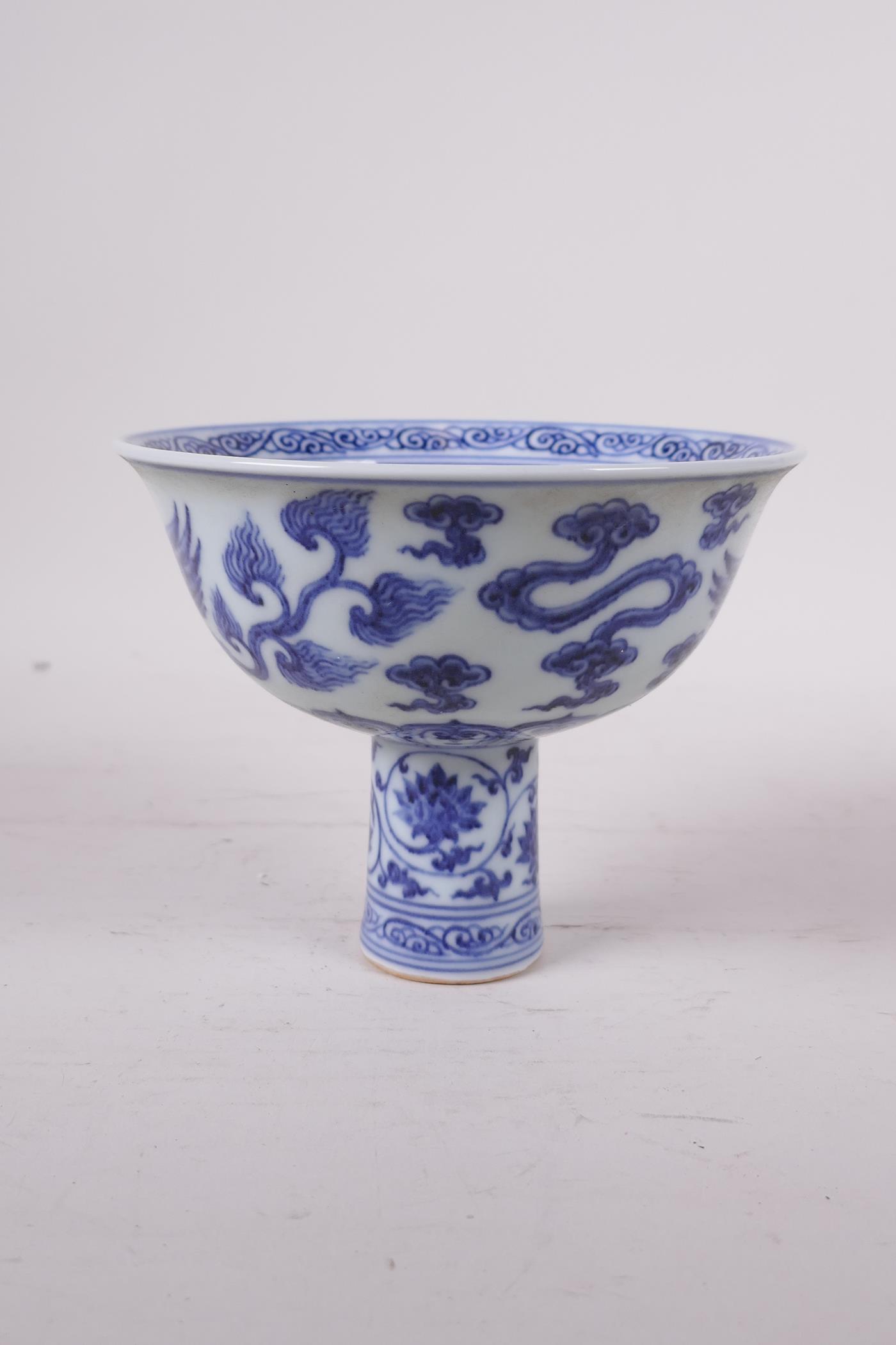A Ming style blue and white porcelain stem bowl with phoenix decoration, Chinese, 4" high x 5" - Image 2 of 5
