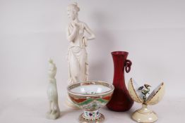 A porcelain pedestal bowl decorated in the Chinese style, 5" high, together with a composition