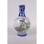 A polychrome porcelain vase decorated with exotic birds and flowers, Qianlong seal mark to base,