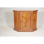 A pine side cabinet with canted corners and painted decoration to the fielded panels, 36" x 12", 30"