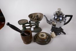 A vintage set of kitchen scales and brass bell weights, a French wood pestle and mortar, a Swan