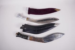 Two replica Kukri knives, both in scabbards, with sharpeners, largest 17" long