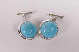 A pair of 925 silver and turquoise set cufflinks