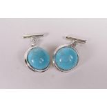 A pair of 925 silver and turquoise set cufflinks