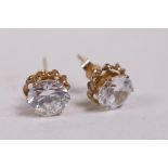 A pair of 9ct gold stud earrings set with cubic zirconium