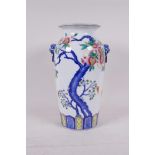 A polychrome porcelain vase with two kylin mask handles and pomegranate tree decoration, seal mark