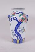 A polychrome porcelain vase with two kylin mask handles and pomegranate tree decoration, seal mark