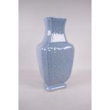 A Chinese duck egg blue glazed porcelain vase with raised archaic style decoration, impressed seal