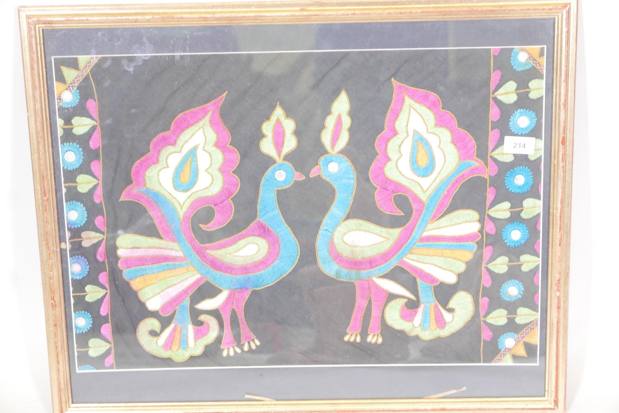 A framed Indian embroidered linen panel, decorated with two stylised peacocks, 25" x 20" - Image 3 of 3