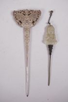 A Chinese white metal hairpin with butterfly decoration, and another hairpin with a carved green