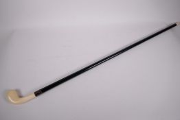 An ebony and ivory 'Sunday' stick with club head handle, 36" long