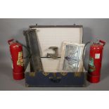 A travel trunk, a stained glass window, small fender, boot last and two fire extinguishers