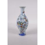 A doucai porcelain vase with peach tree and bat decoration, six character mark to base, 8" high