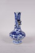 A Chinese blue and white porcelain vase of squat form with raised kylin to the neck and carp