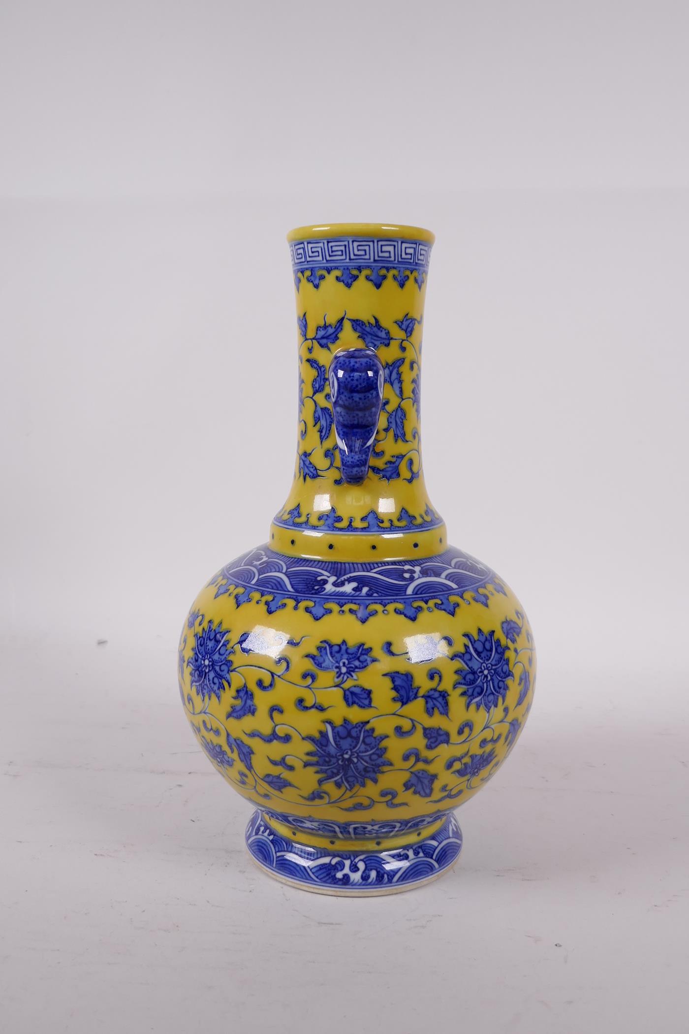 A Ming style yellow ground porcelain vase with two elephant mask handles, with blue and white - Image 2 of 4