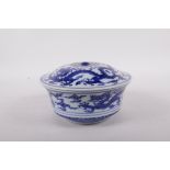 A Chinese blue and white porcelain steep sided bowl and cover decorated with dragons, six