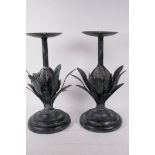 A pair of metal pricket candlesticks in the form of artichokes, 12" high