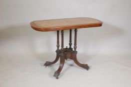 A Victorian inlaid walnut centre table with a quarter veneered top on four turned supports and swept