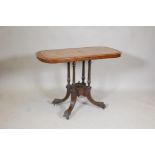 A Victorian inlaid walnut centre table with a quarter veneered top on four turned supports and swept