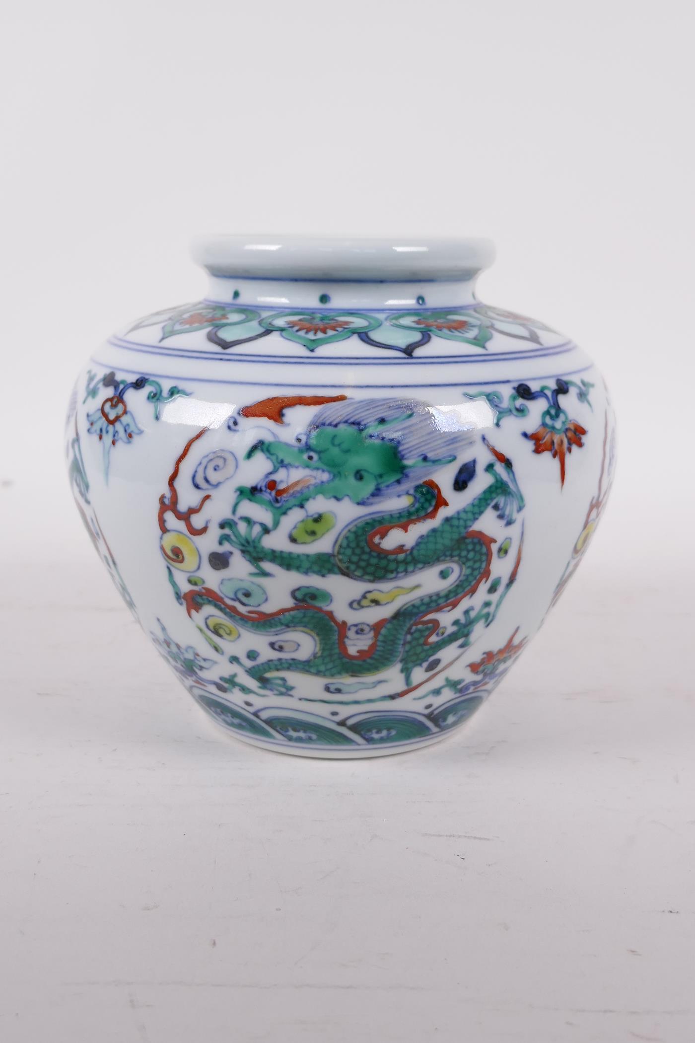 A Doucai porcelain jar decorated with five toed dragons chasing the flaming pearl, six character - Image 3 of 5