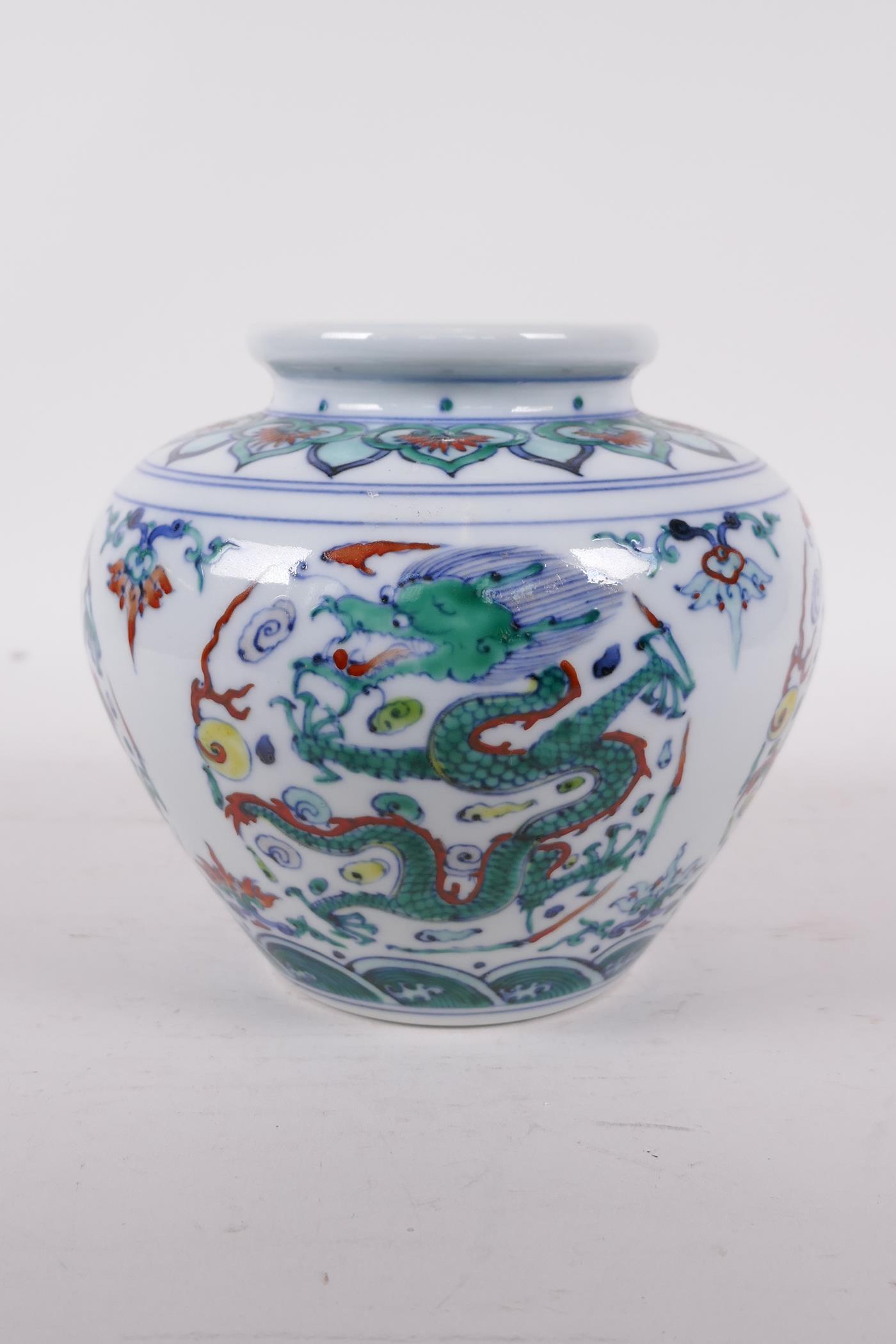 A Doucai porcelain jar decorated with five toed dragons chasing the flaming pearl, six character - Image 2 of 5