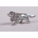 A sterling silver figure of a spaniel, 1½" long