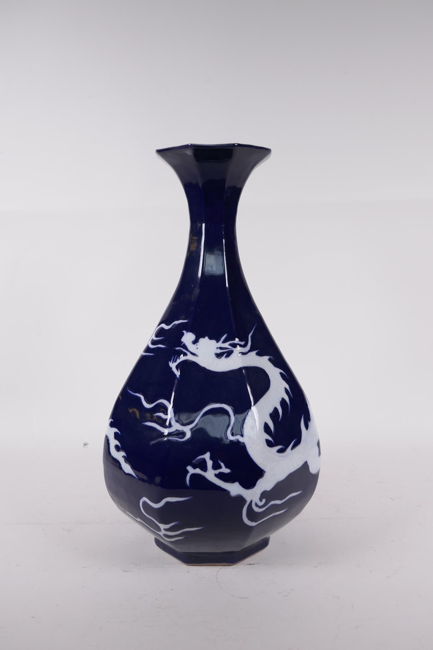 A Chinese blue glazed porcelain pear shaped vase with incised dragon decoration, 13" high