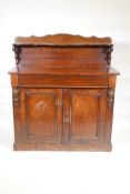 A Victorian mahogany chiffonier, with shaped back and single frieze drawer over two cupboards,