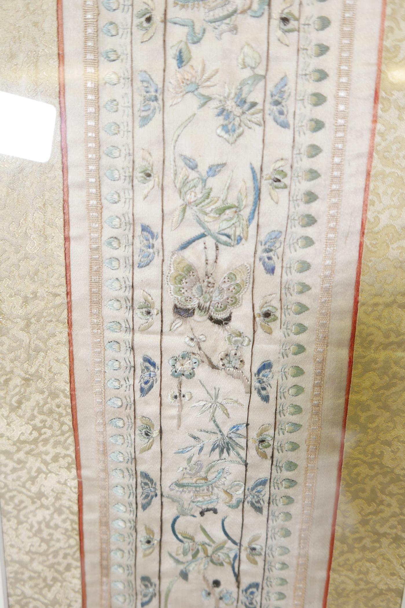 A framed C20th Chinese silk sleeve band, 23" x 7" - Image 2 of 3