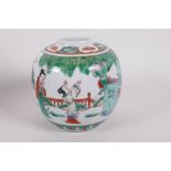 A Chinese porcelain famille vert ginger jar, decorated with figures in a garden, four character mark