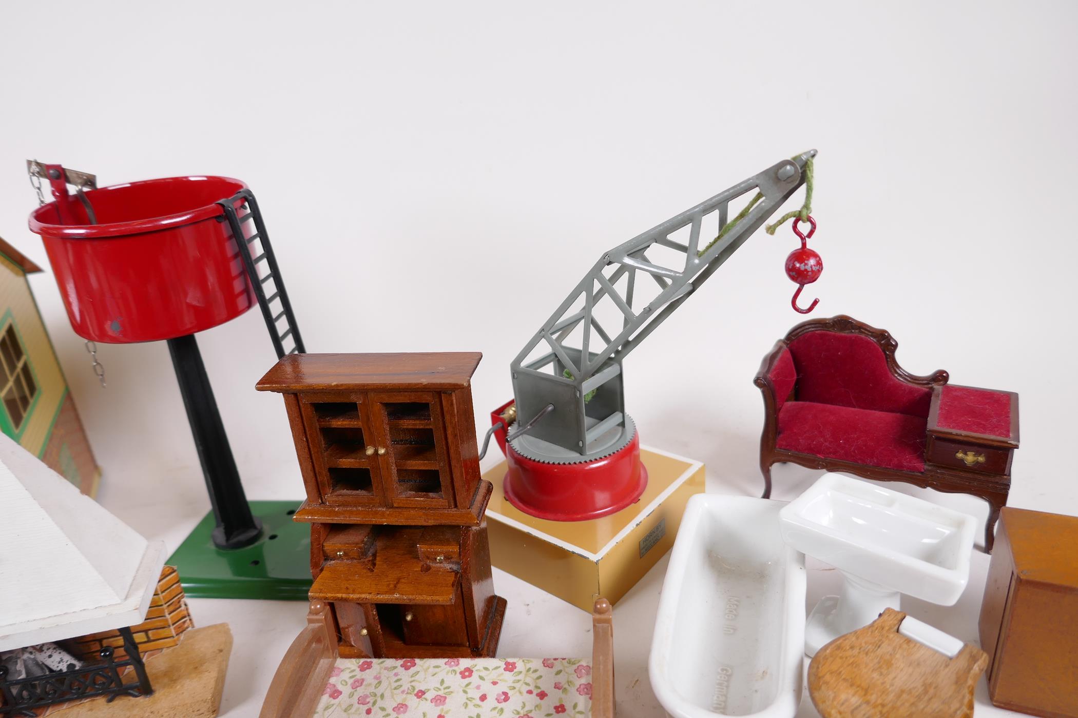 Three Hornby railway items, signal box, water tank and crane, together with a quantity of dolls - Image 4 of 5