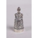A sterling silver thimble and pincushion in the form of a lady, 1½" high