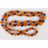 A string of butterscotch and cherry amber beads, 36" long (40g)