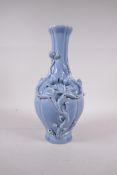 A Chinese blue glazed porcelain vase with applied fruiting peach tree decoration, seal mark to base,