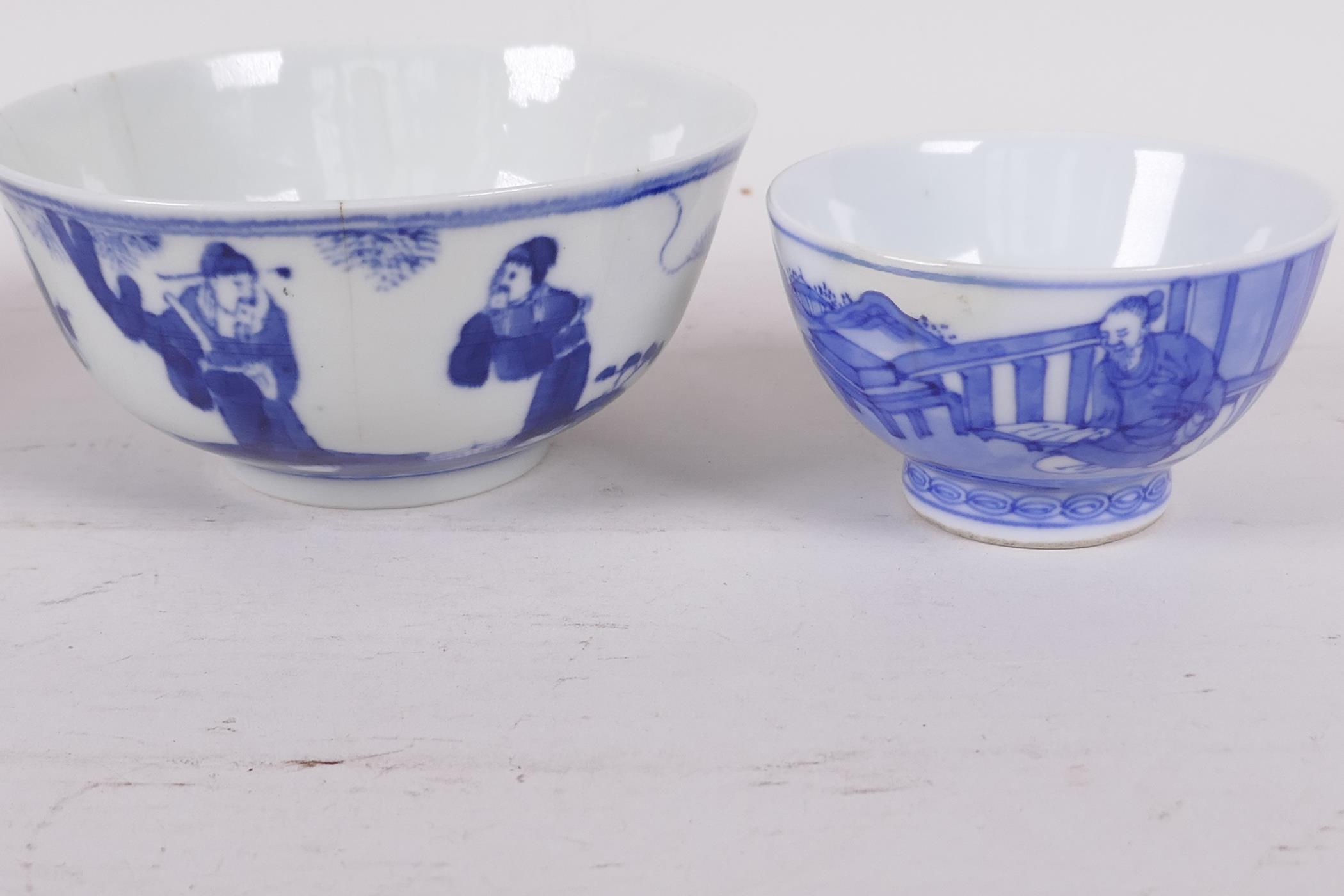 A Chinese blue and white porcelain tea bowl decorated with a figure in a continuous landscape, 6