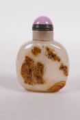 A Chinese agate snuff bottle with carved figural decoration, 2" high