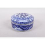 A blue and white porcelain cylinder box and cover with dragon decoration, six character mark to