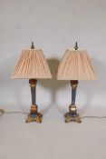 A pair of parcel gilt table lamps made in the form of square section classical columns, 30" high