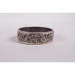 A Chinese reticulated white metal bangle with phoenix decoration, 2" diameter