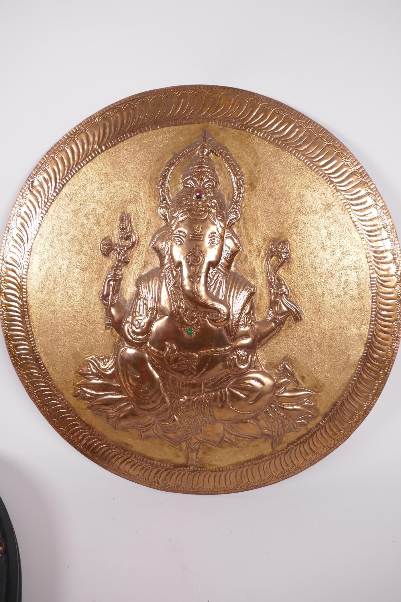 A copper wall plaque depicting Ganesh with bejewelled necklace and headdress, 12" diameter, together - Image 2 of 3