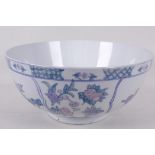A Chinese porcelain bowl decorated with birds in flowering branches, 12" diameter
