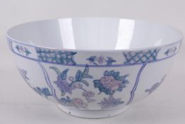 A Chinese porcelain bowl decorated with birds in flowering branches, 12" diameter