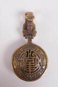 A Chinese bronze buckle decorated with bats and auspicious symbols