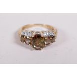 A 10ct yellow gold ring set with tourmaline and diamonds, approx size P