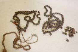 A string of vintage Tibetan Rudraksha beads, 60" long, and three other strings, one A/F