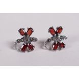 A pair of silver dragonfly earrings set with garnets and marcasite