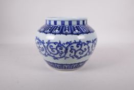 A Ming style blue and white porcelain jar decorated with a scrolling pattern, six character mark