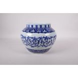 A Ming style blue and white porcelain jar decorated with a scrolling pattern, six character mark