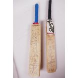 Two miniature 'Charity Sale' cricket bats, signed by 1990s West Indies and South African teams,