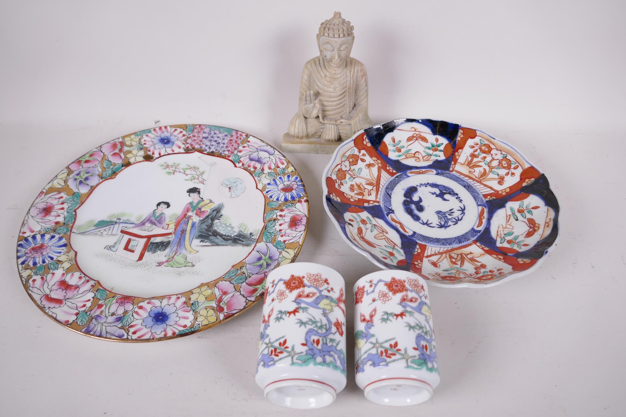 A Chinese porcelain plate painted with girls in a garden, 10" diameter, a C19th Imari plate, 8"